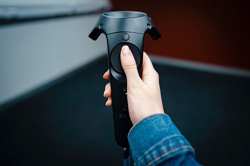 person holding black remote